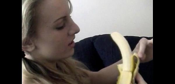  Naughty amateur blonde Julie removes clothes and teases pussy with banana